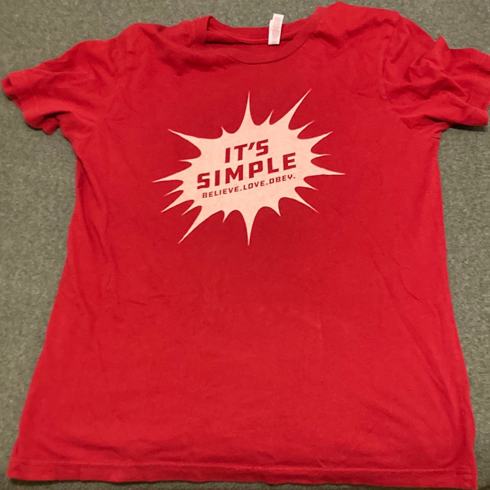 Large Canvas brand shirt with Christian related design.